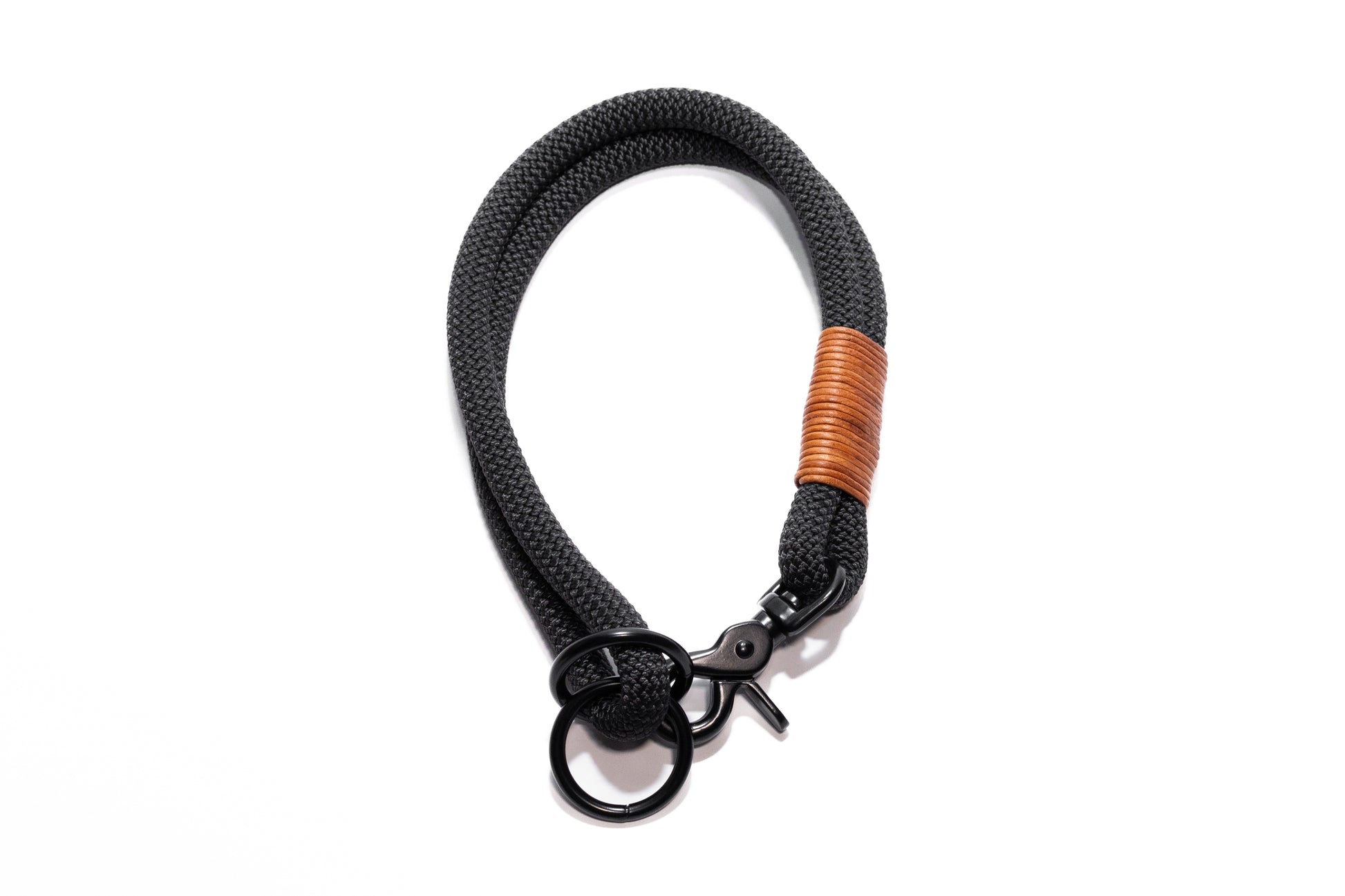 Handcrafted climbing rope and leather hybrid slip dog collar. Featuring high quality black hardware, including a swivel trigger snap. Custom sizing. Cross Winds Leather.