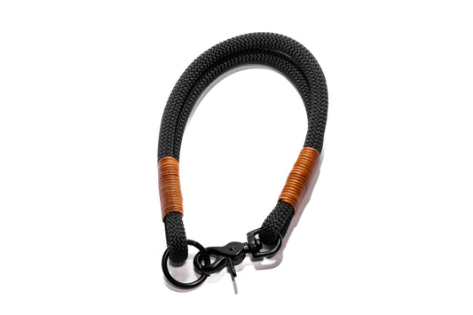 Handcrafted climbing rope and leather fixed, house dog collar. Featuring high quality black hardware, including a swivel trigger snap. Custom sizing. Cross Winds Leather.