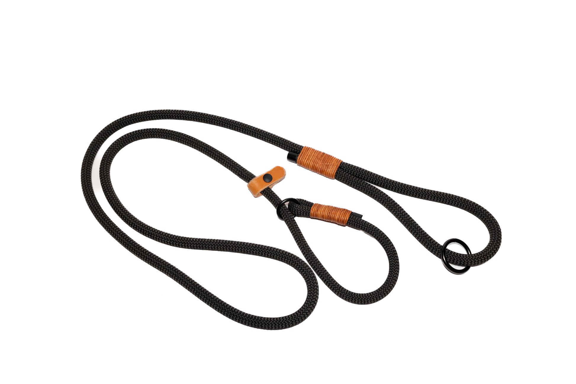 Handcrafted climbing rope and leather dog slip leash. Featuring high quality, heavy-duty black hardware. Rope Handle. Cross Winds Leather.