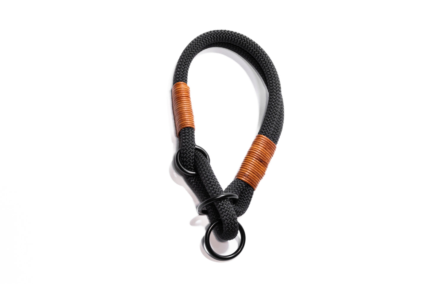 Handcrafted climbing rope and leather limited slip dog collar. Featuring high quality, heavy-duty black hardware and custom sizing to ensure a perfect fit. Cross Winds Leather.
