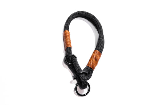 Handcrafted climbing rope and leather limited slip dog collar. Featuring high quality, heavy-duty black hardware and custom sizing to ensure a perfect fit. Cross Winds Leather.