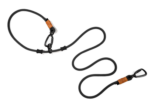 Handcrafted climbing rope and leather hand-free, multi-use dog leash. Featuring black swivel auto-locking carabiners and durable rubber stoppers. Cross Winds Leather.