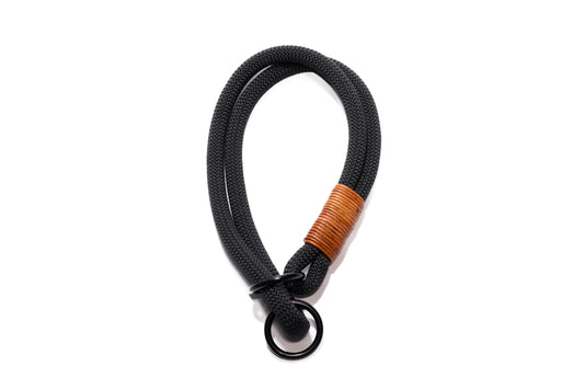 Handcrafted climbing rope and leather slip dog collar. Featuring high quality, heavy-duty black hardware. Custom sizing. Cross Winds Leather.