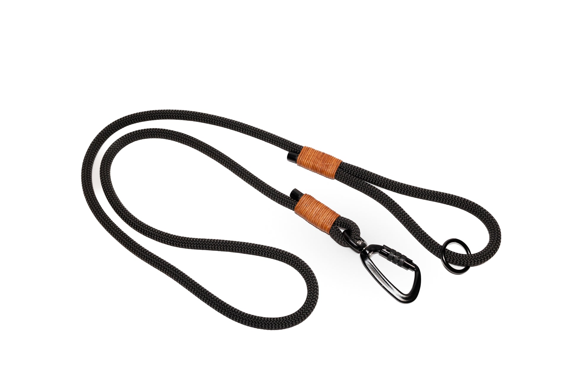 Handcrafted climbing rope and leather dog leash. Featuring high quality, heavy-duty black hardware, including a swivel auto-locking carabiner. Rope handle. Cross Winds Leather.