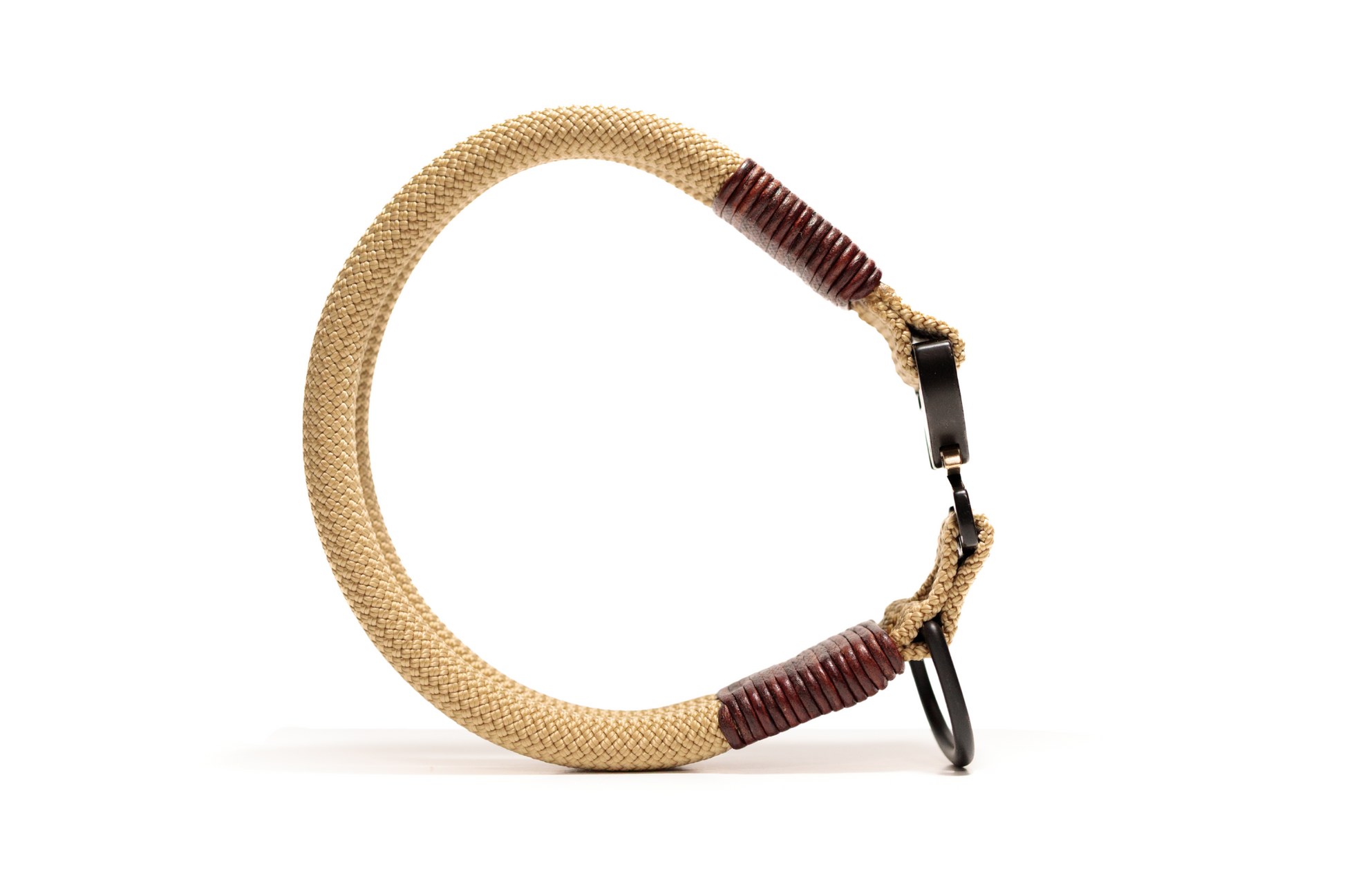 Handcrafted climbing rope and leather fixed dog collar. Featuring high quality hardware, including an AustriAlpin cobra buckle. Custom sizing. Cross Winds Leather.